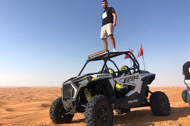 Experience the thrill of conquering sandy dunes in Dubai as you navigate powerful buggies across stunning desert landscapes making unforgettable memories along the way. Adventure awaits!